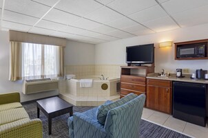 Suite, 1 King Bed, Non Smoking, Jetted Tub (with Sofabed) | Pillowtop beds, laptop workspace, blackout drapes, iron/ironing board