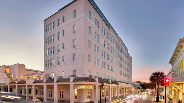 A multi-story hotel with a pink facade, multiple balconies, and a prominent 'LA CONCHA' sign. - La Concha Key West, Autograph Collection (Key West)