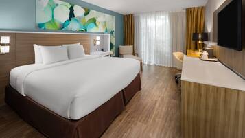 Hypo-allergenic bedding, desk, laptop workspace, blackout curtains