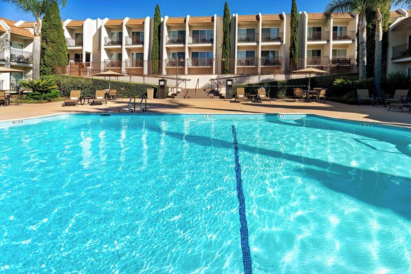 Outdoor pool, a heated pool, pool umbrellas, sun loungers