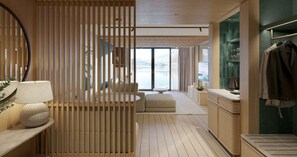 Habitación de hotel moderna con un separador de madera, un sofá, un comedor y vistas al mar.