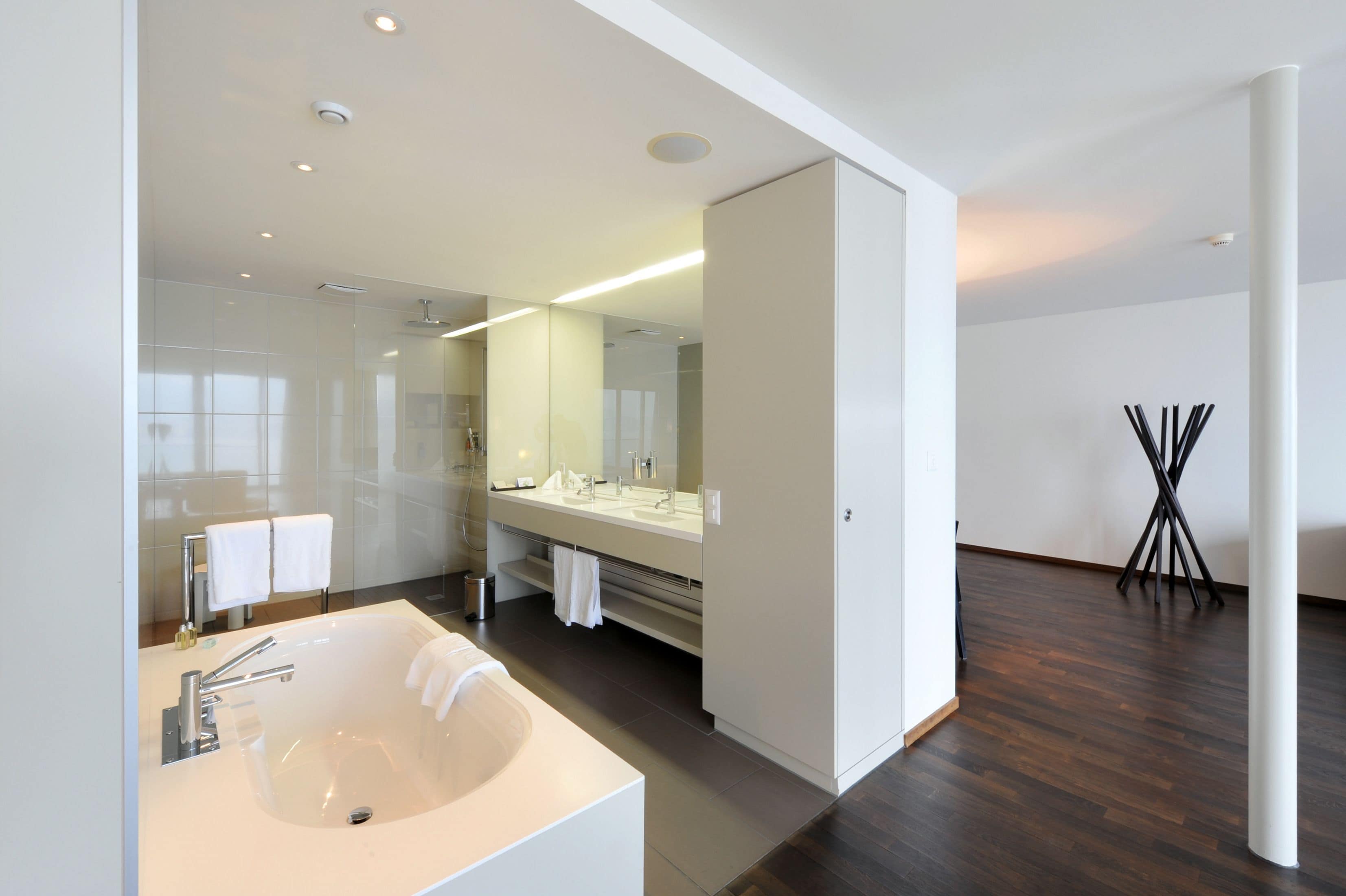 lake view deluxe suite room | bathroom | designer toiletries, hair dryer, bathrobes, slippers