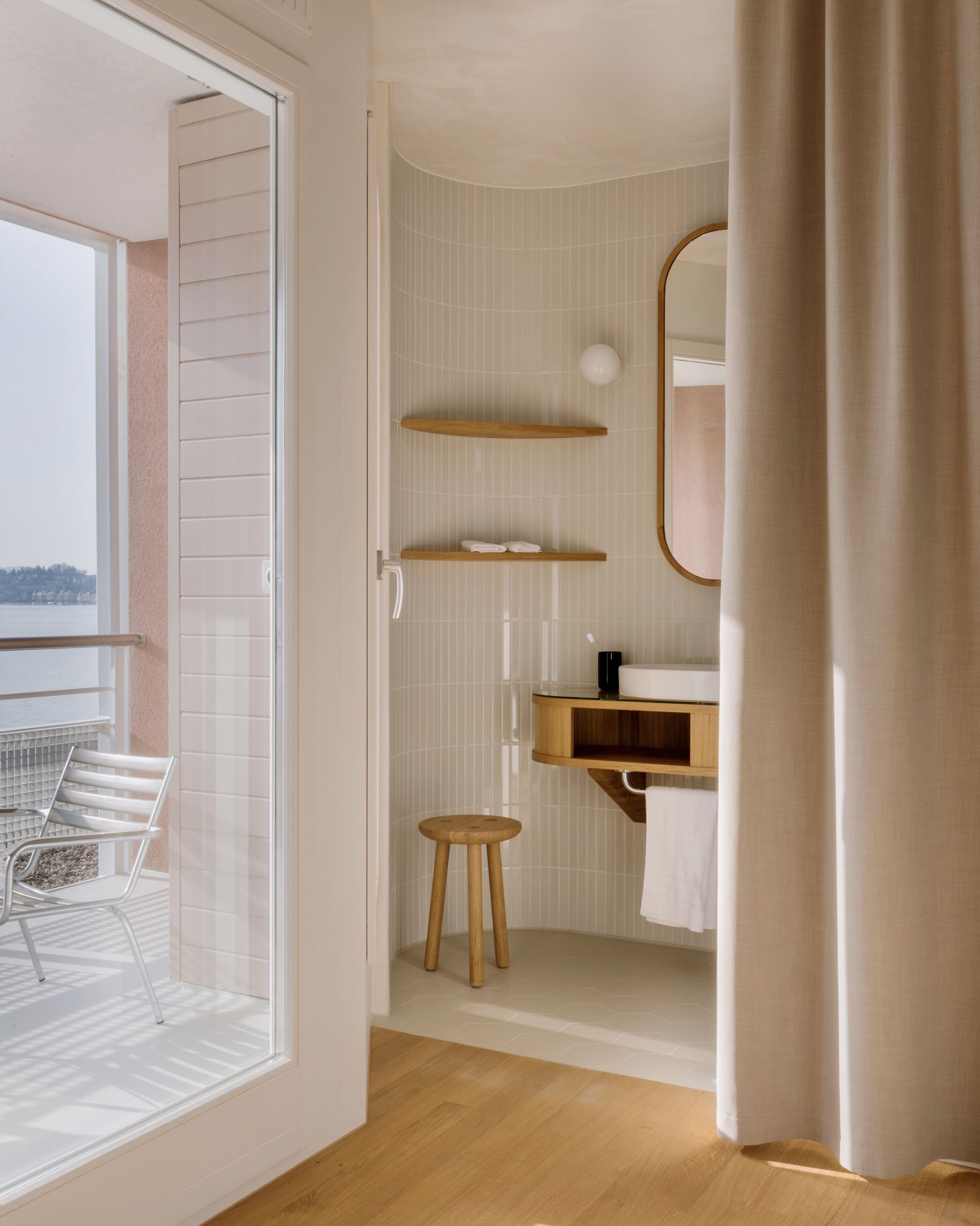 lake view design balcony room | bathroom | designer toiletries, hair dryer, bathrobes, slippers