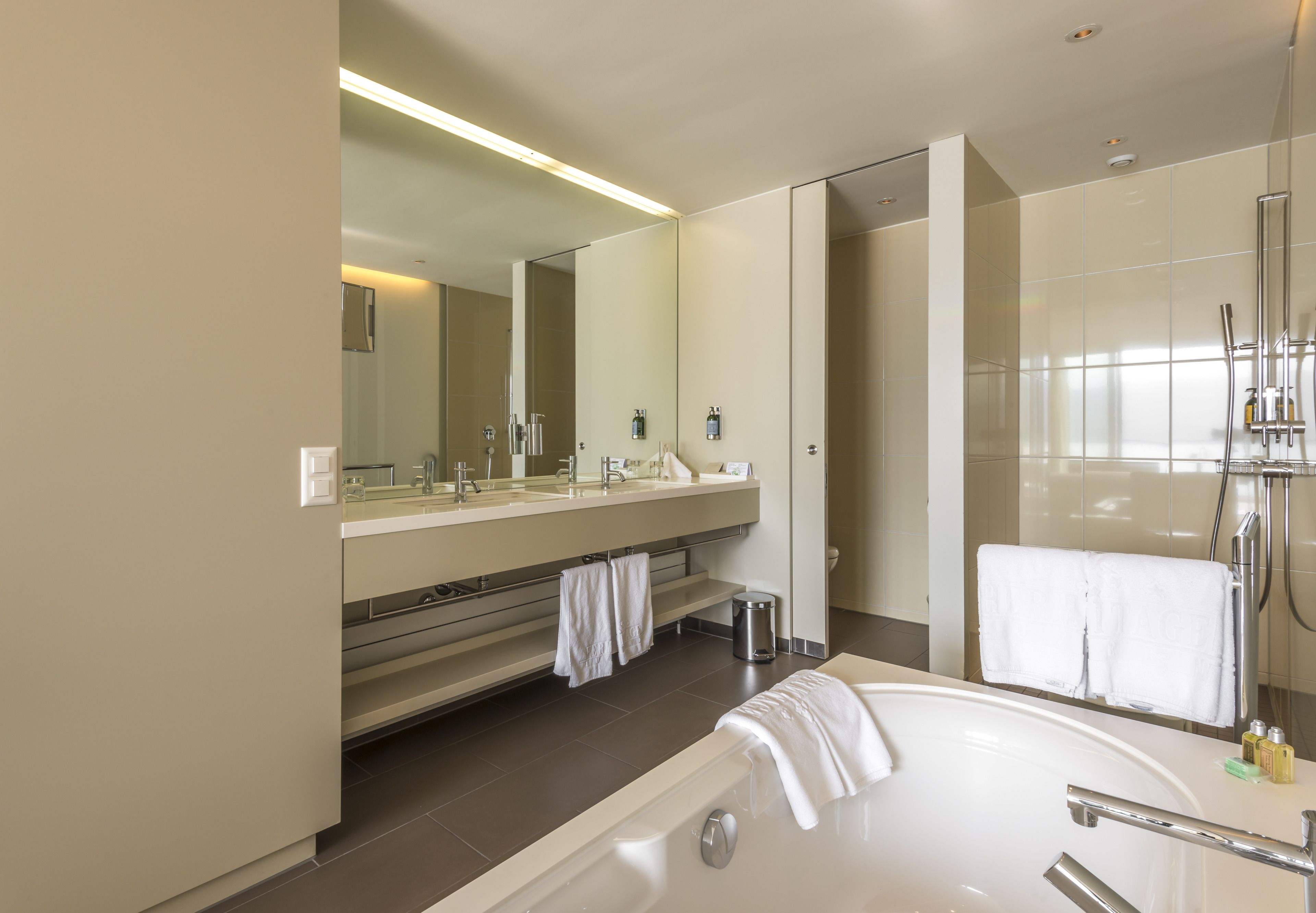 lake view deluxe room | bathroom | designer toiletries, hair dryer, bathrobes, slippers