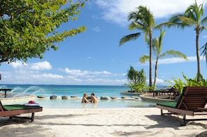Private beach, white sand, sun loungers, beach umbrellas