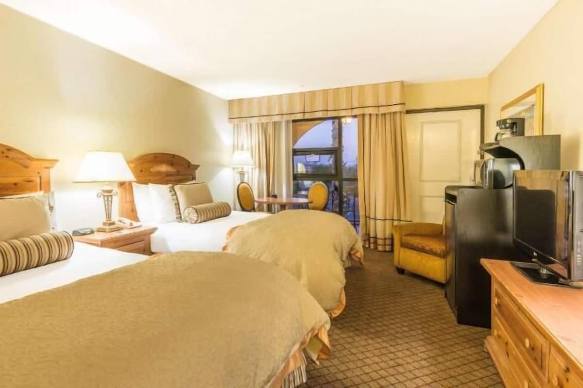 Pillow-top beds, desk, blackout curtains, iron/ironing board