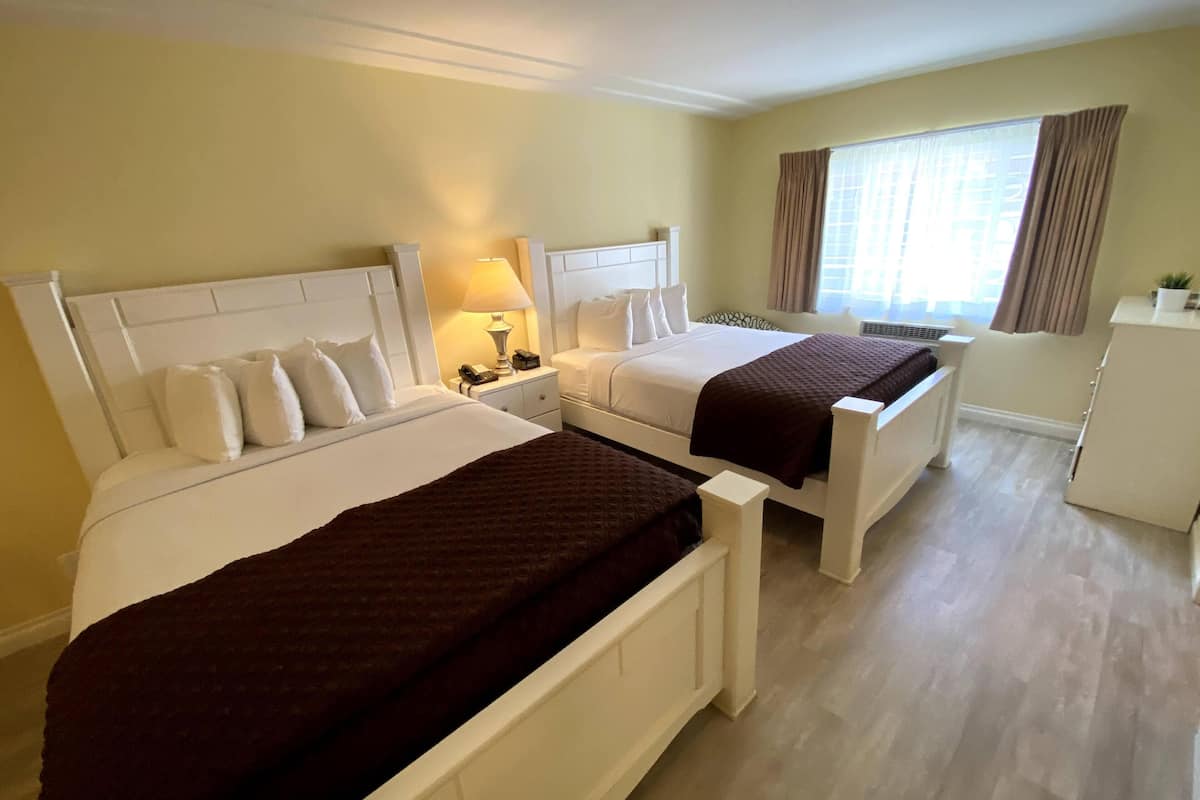 executive room, 2 queen beds, kitchen | blackout curtains, iron/ironing board, free cots/infant beds