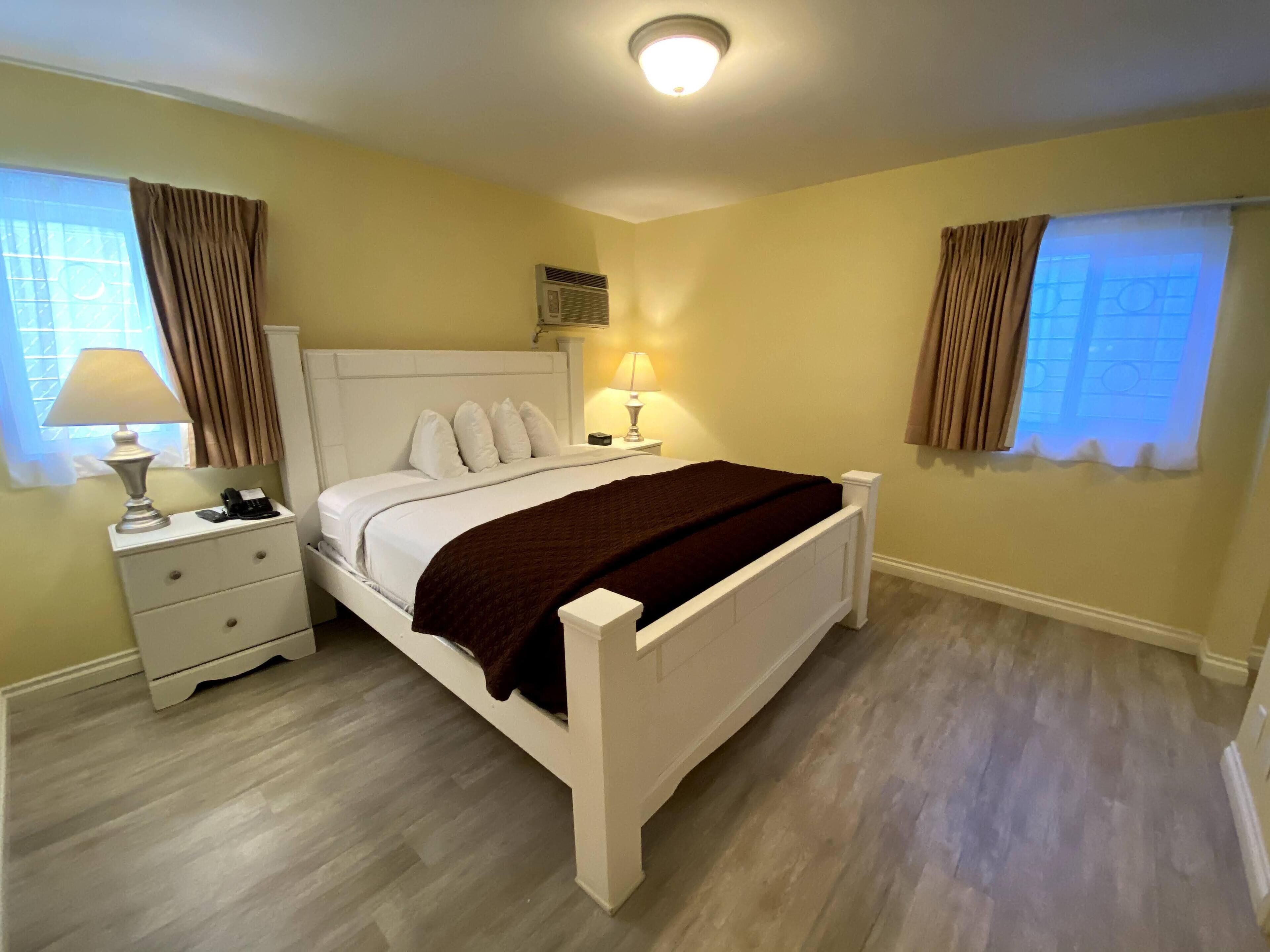 deluxe two king  | blackout curtains, iron/ironing board, free cots/infant beds