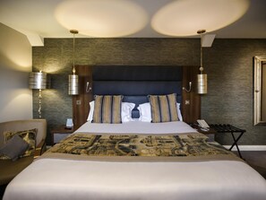 Premium bedding, down comforters, pillowtop beds, in-room safe