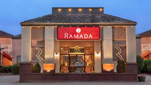 A building with a sign reading "RAMADA" and a fountain in front. - Ramada by Wyndham Arcata (Arcata)