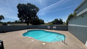 Outdoor pool, open 9:00 AM to 10:00 PM, pool umbrellas, sun loungers