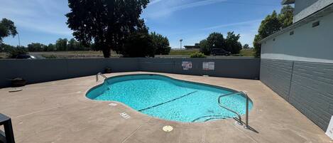 Outdoor pool, open 9:00 AM to 10:00 PM, pool umbrellas, sun loungers