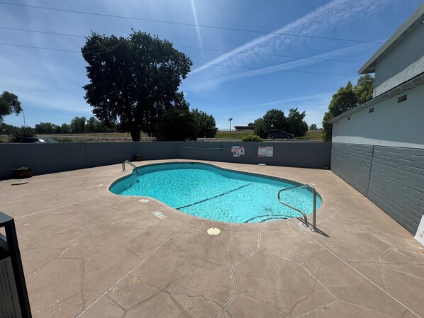 Outdoor pool, open 9:00 AM to 10:00 PM, pool umbrellas, sun loungers