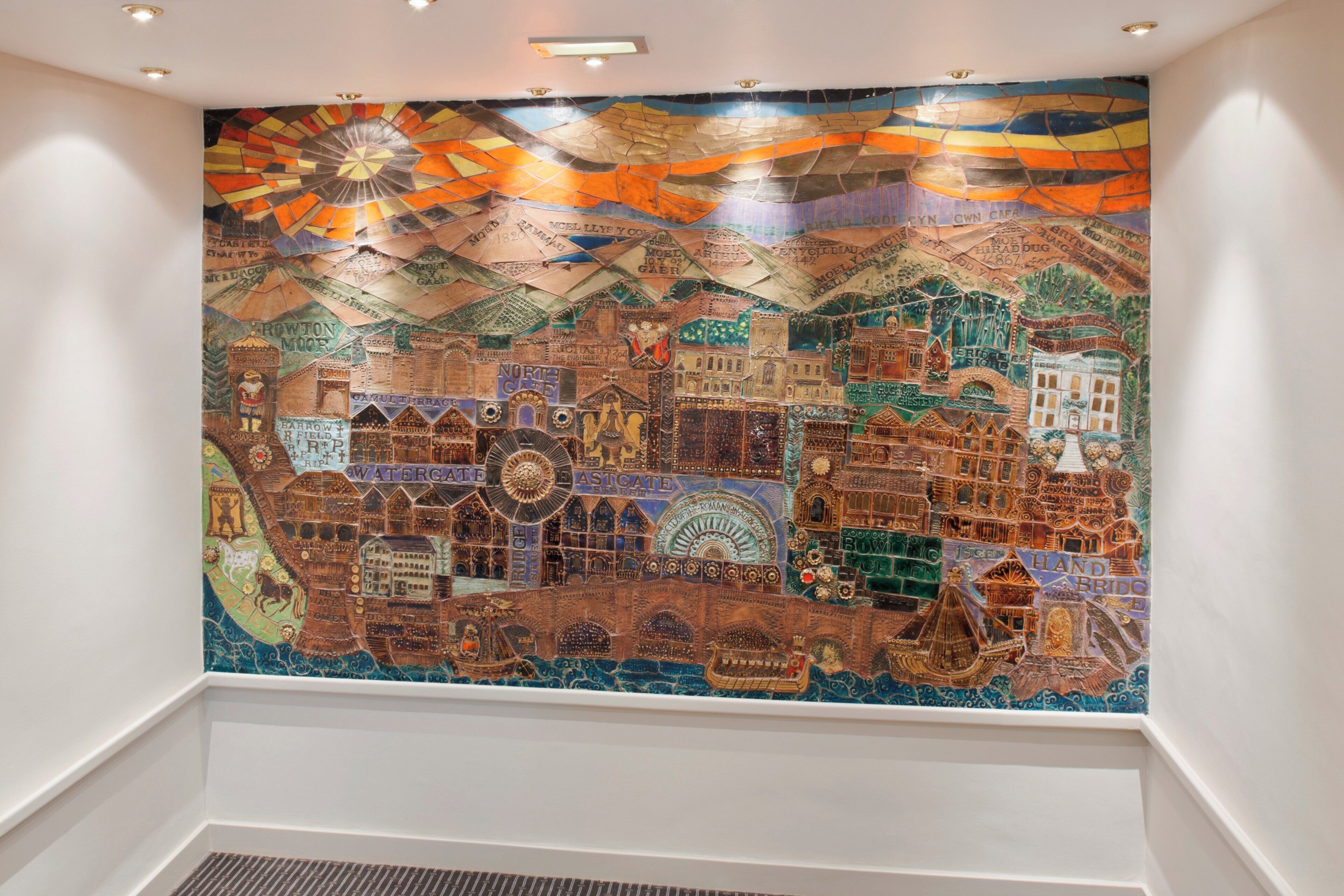 A detailed mosaic artwork on a wall.