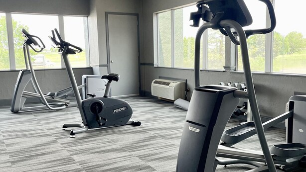 A gym with treadmills, an elliptical, and a stationary bike. - Comancheria Hotel & Convention Center (Lawton)