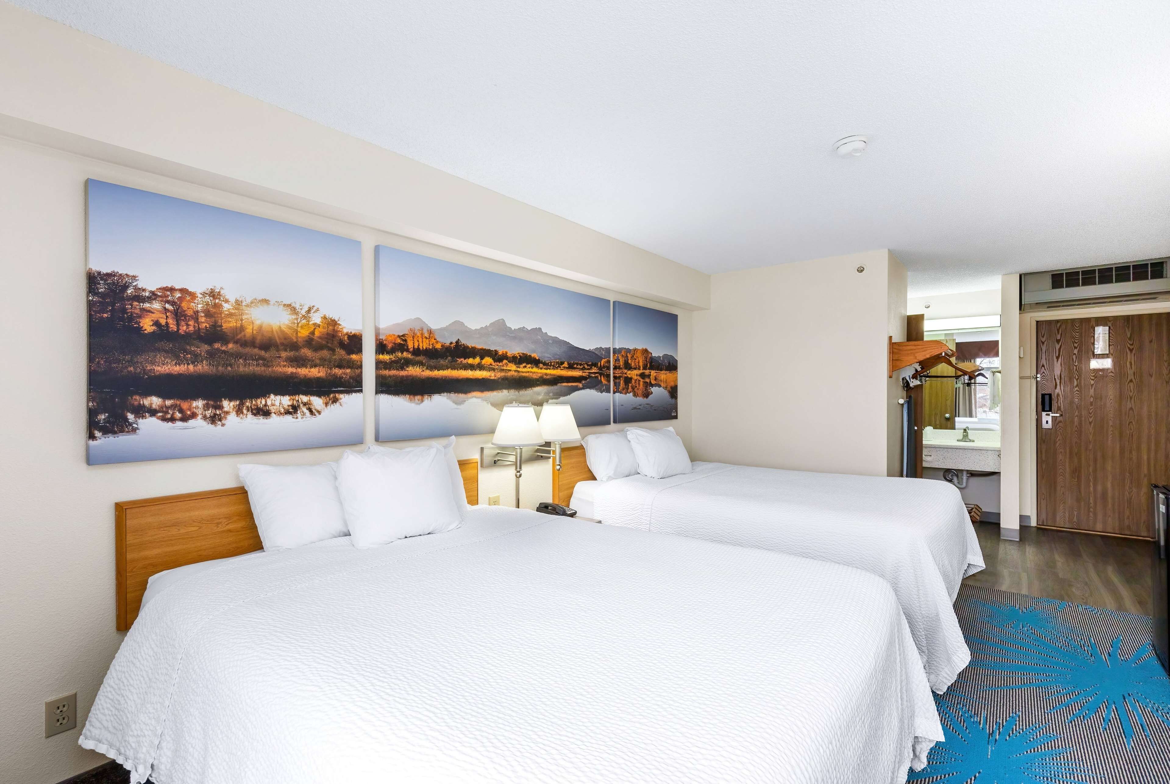 deluxe room, 2 queen beds, non smoking | in-room safe, desk, soundproofing, iron/ironing board