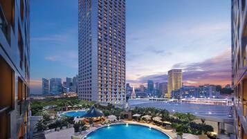 2 outdoor pools, open 7:00 AM to 9:00 PM, pool umbrellas, pool loungers