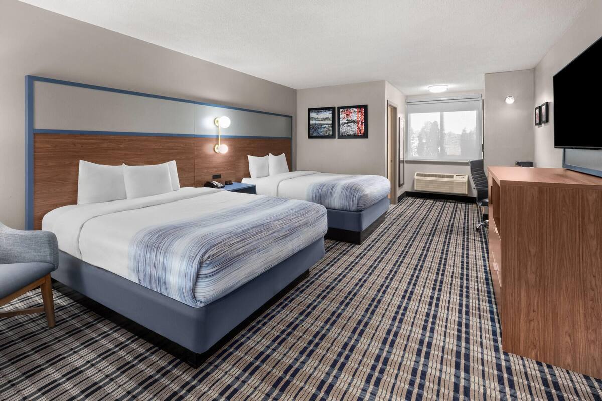 Premium bedding, pillowtop beds, laptop workspace, blackout drapes