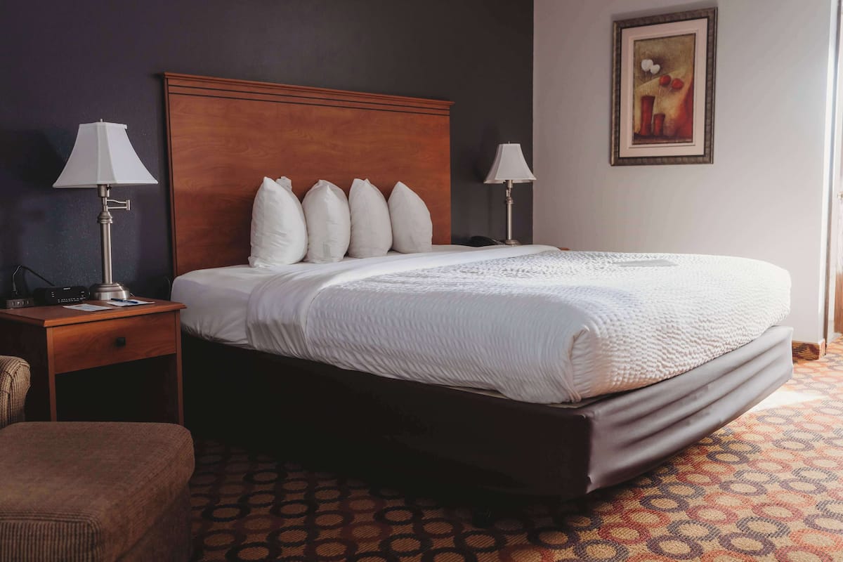 Premium bedding, pillowtop beds, laptop workspace, blackout drapes