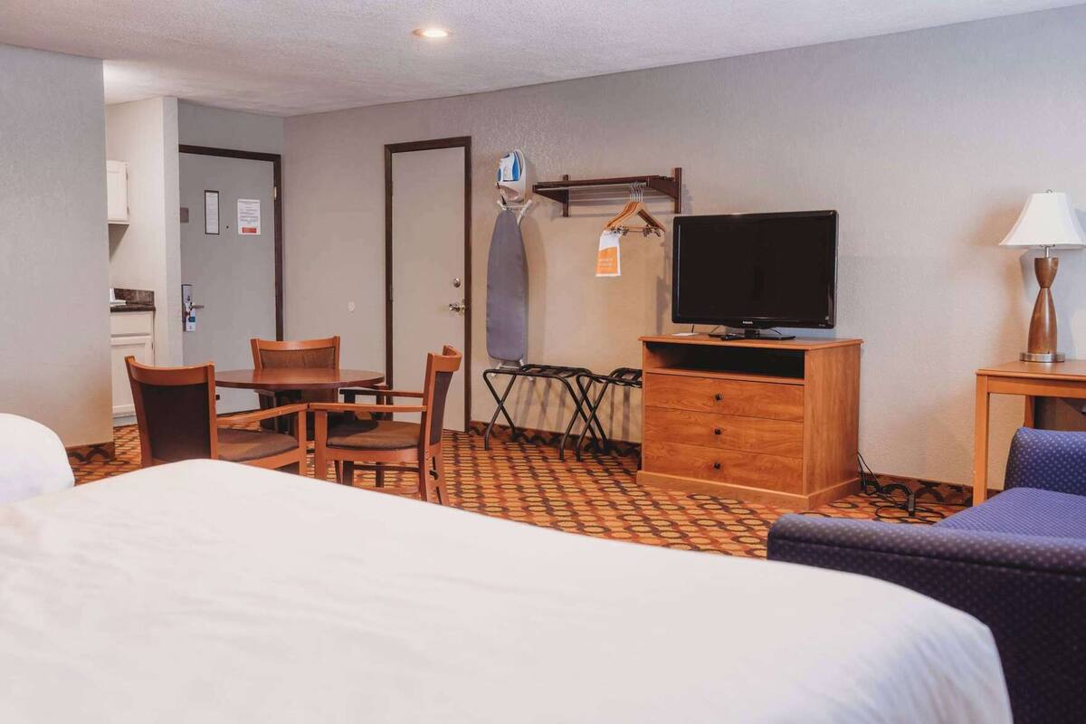 Premium bedding, pillowtop beds, laptop workspace, blackout drapes