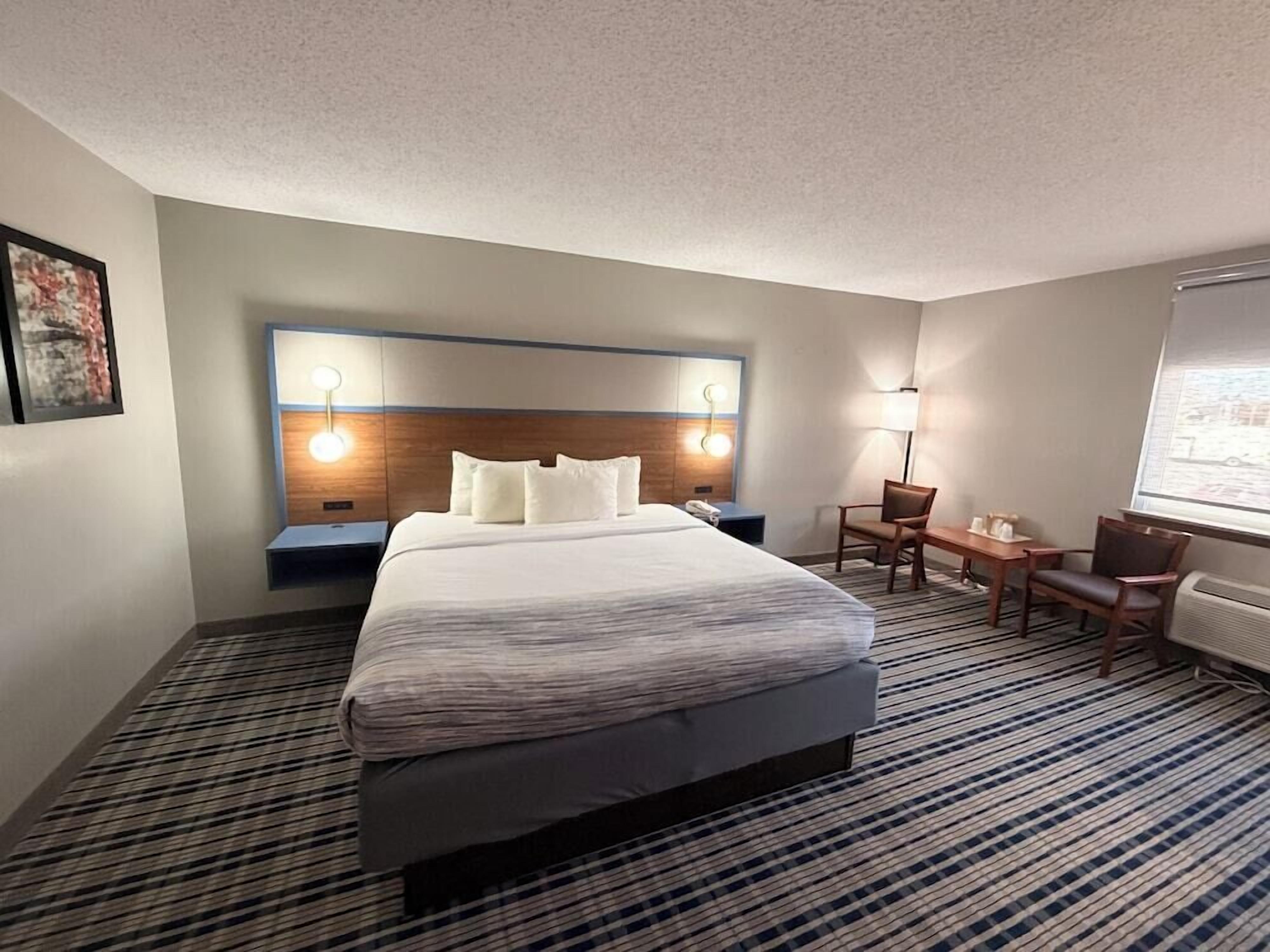 Premium bedding, pillow-top beds, laptop workspace, blackout curtains