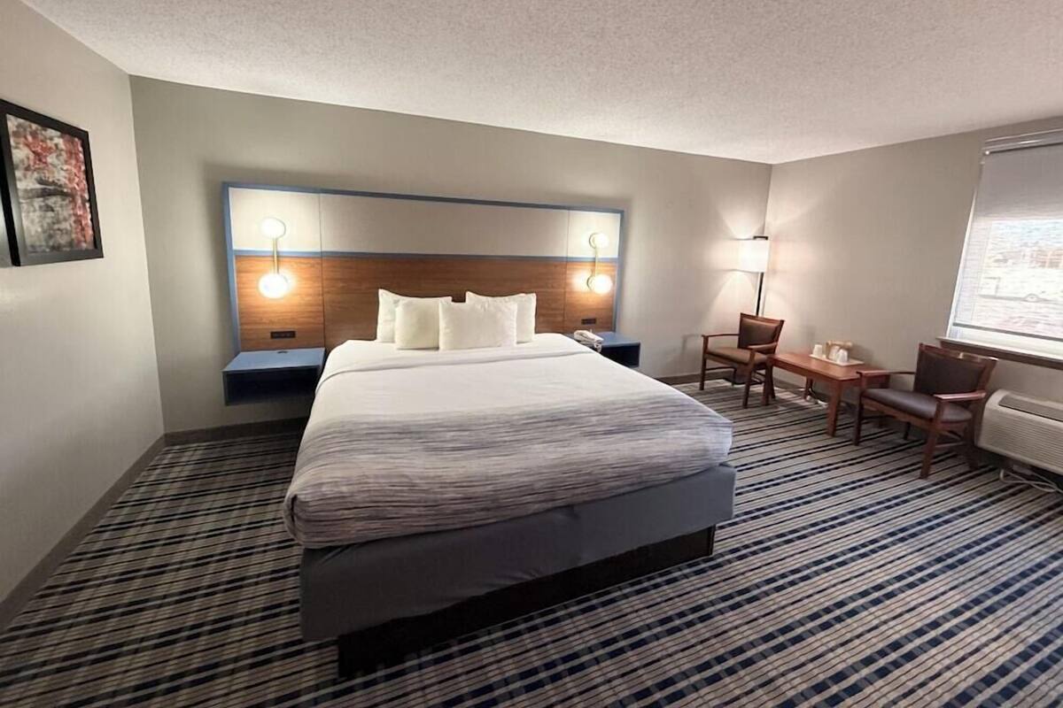 Premium bedding, pillow-top beds, laptop workspace, blackout curtains