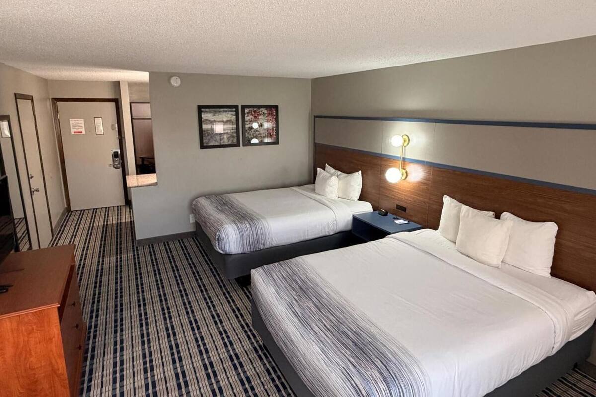 Premium bedding, pillowtop beds, laptop workspace, blackout drapes