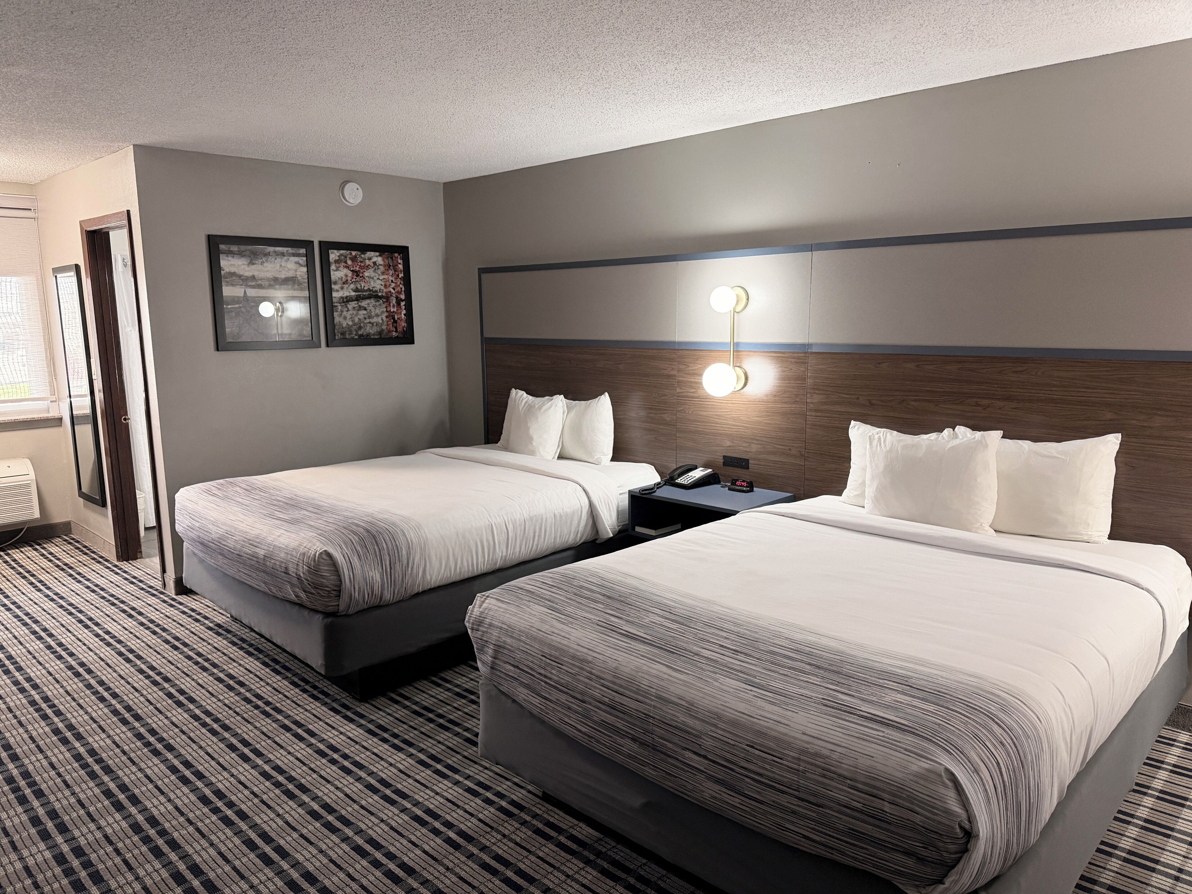 Premium bedding, pillowtop beds, laptop workspace, blackout drapes