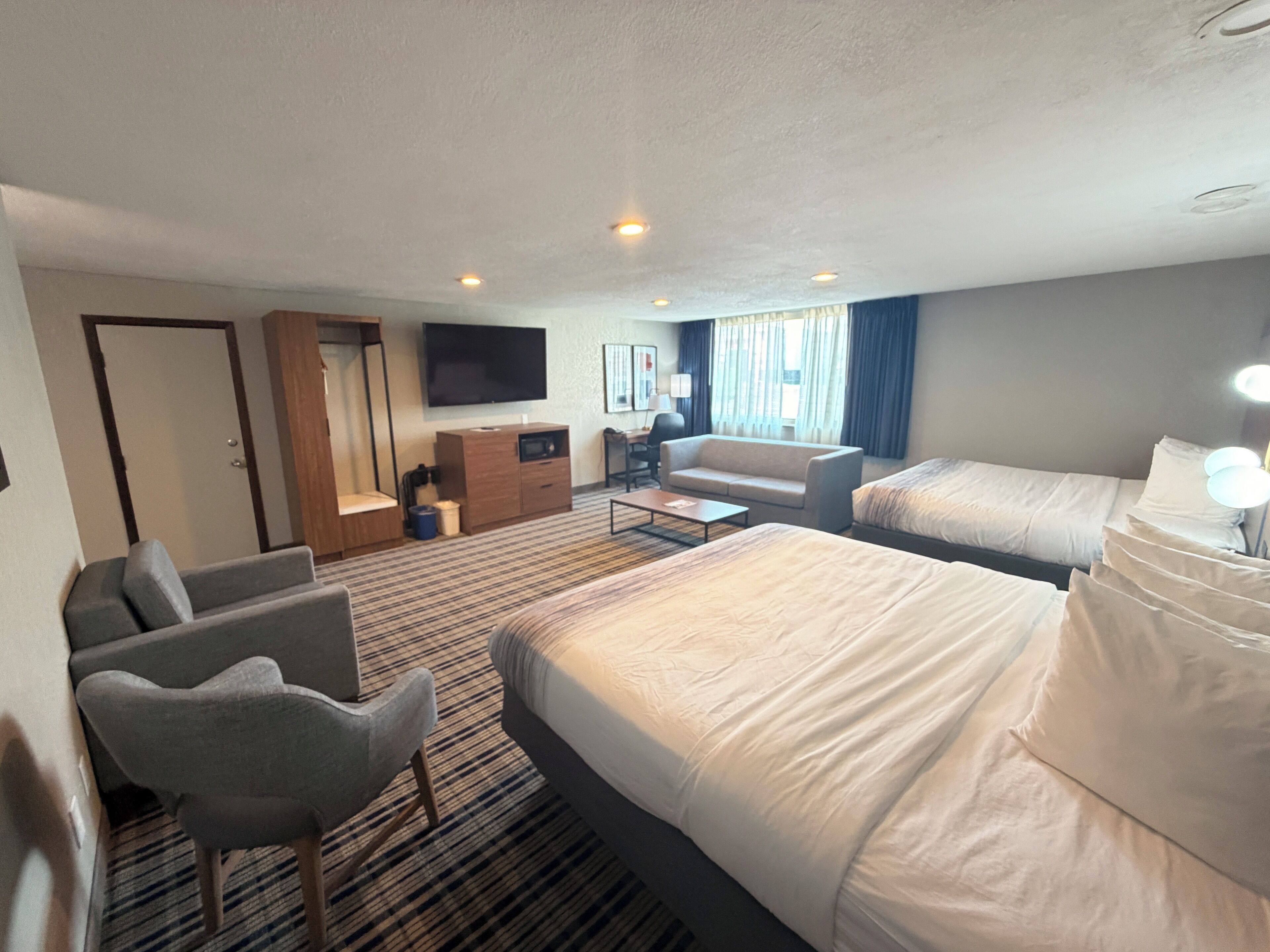 Premium bedding, pillowtop beds, laptop workspace, blackout drapes