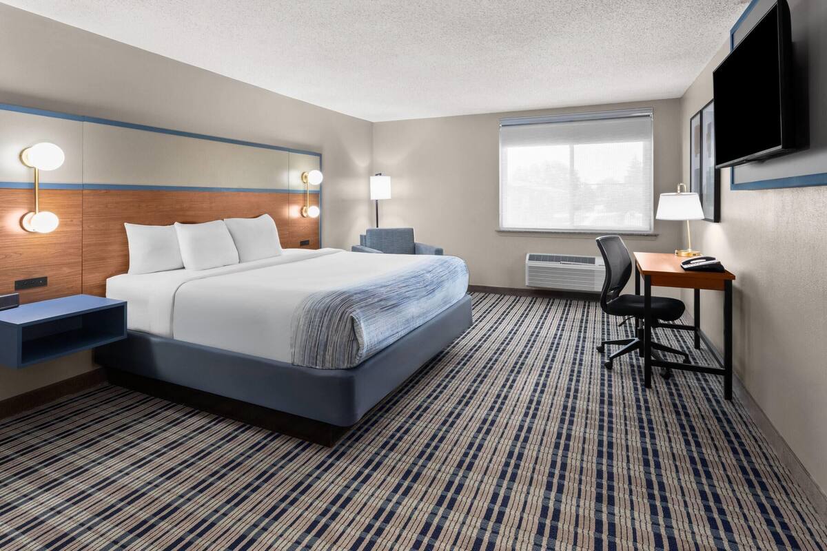 Premium bedding, pillowtop beds, laptop workspace, blackout drapes