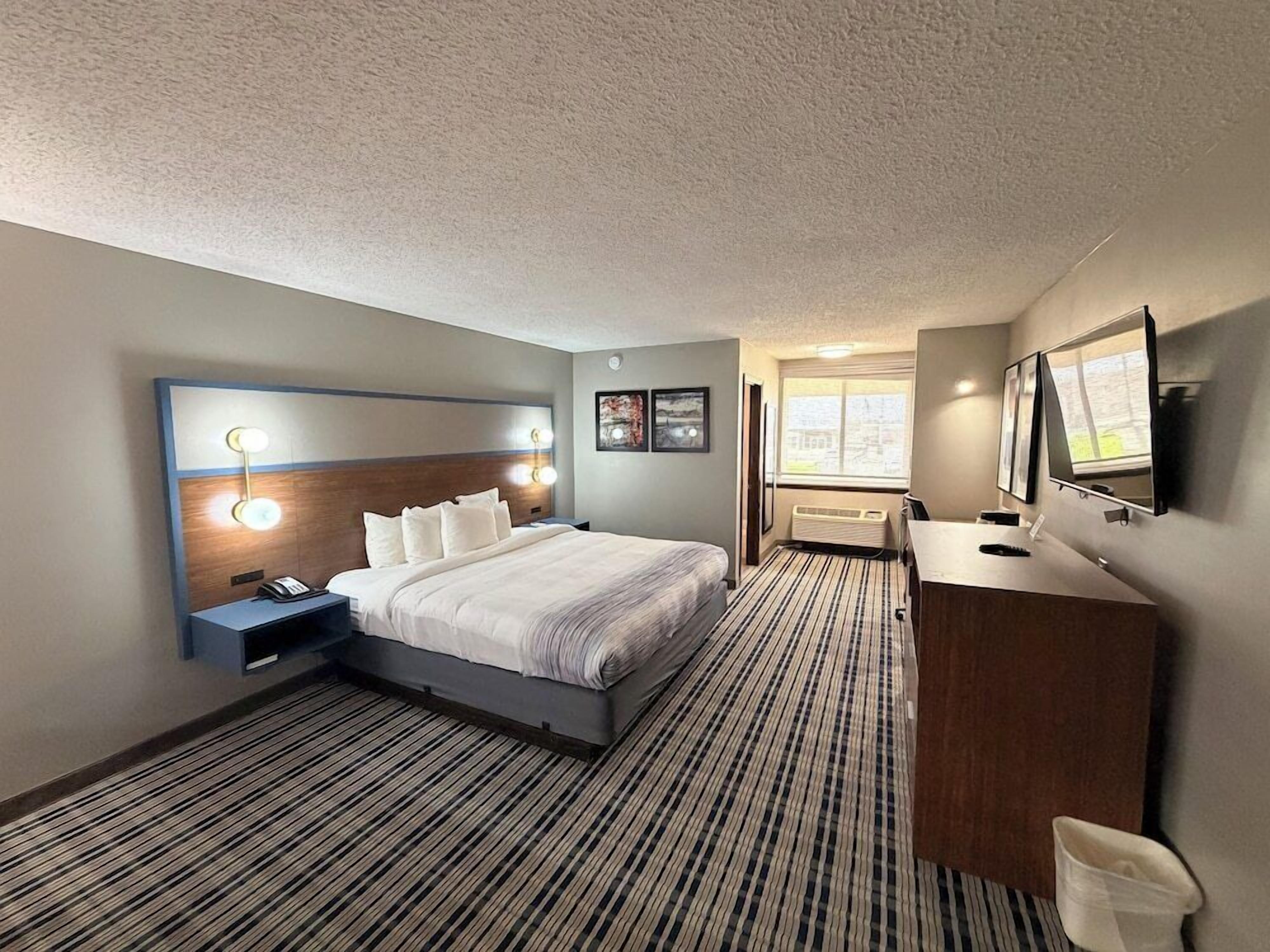 Premium bedding, pillow-top beds, laptop workspace, blackout curtains