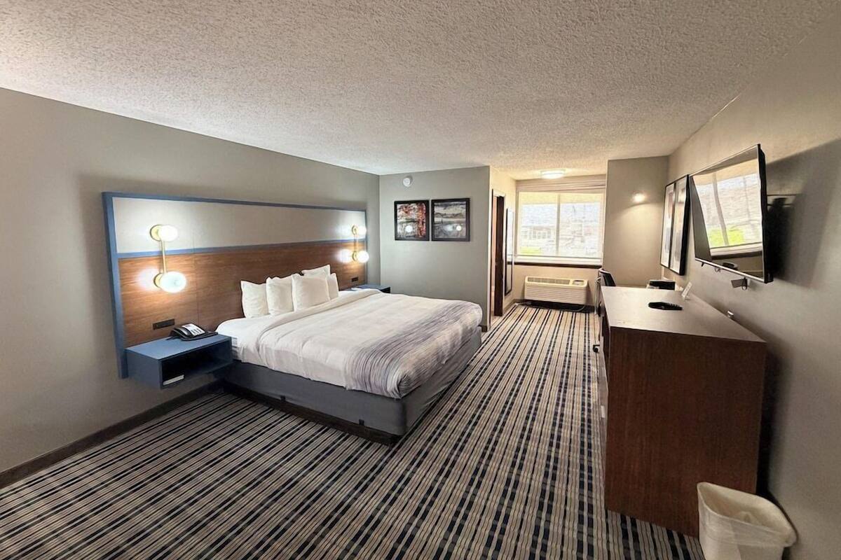 Premium bedding, pillow-top beds, laptop workspace, blackout curtains