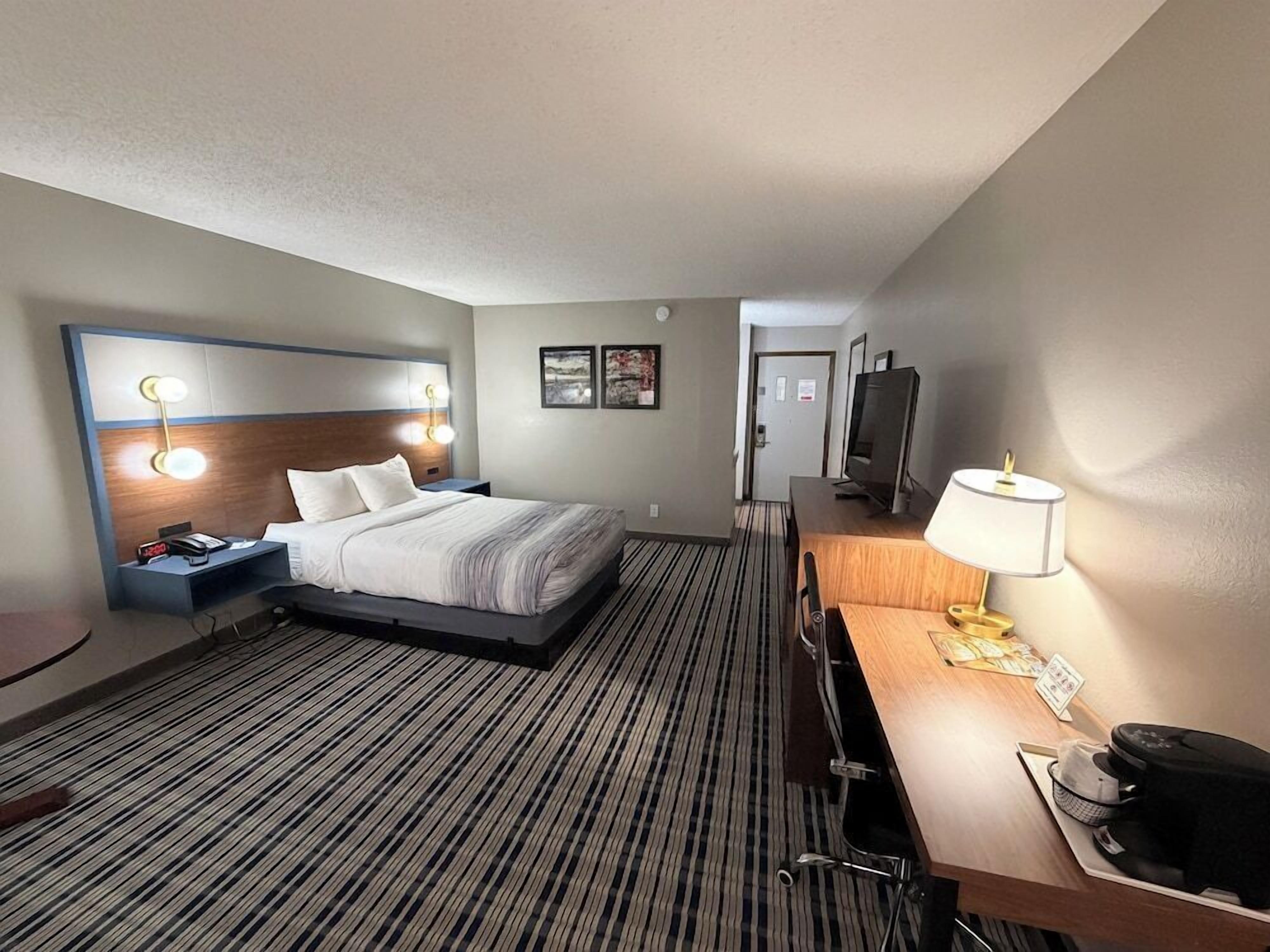Premium bedding, pillow-top beds, laptop workspace, blackout curtains