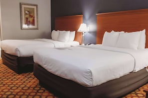 Premium bedding, pillowtop beds, laptop workspace, blackout drapes