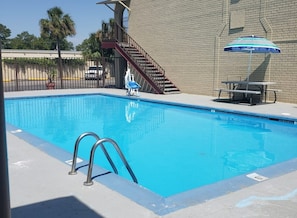 Seasonal outdoor pool, pool umbrellas, sun loungers