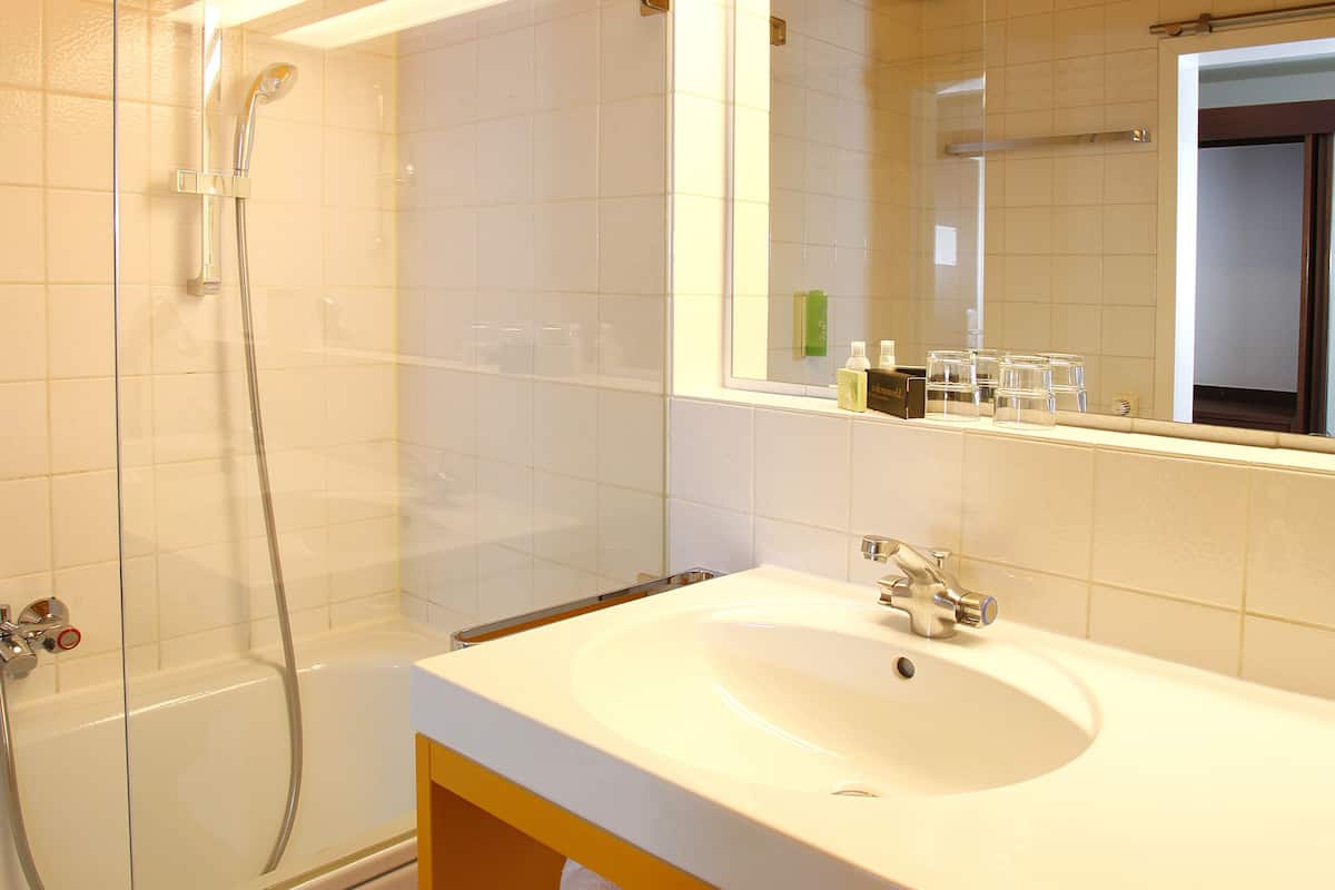 bathtub, free toiletries, hair dryer, bathrobes