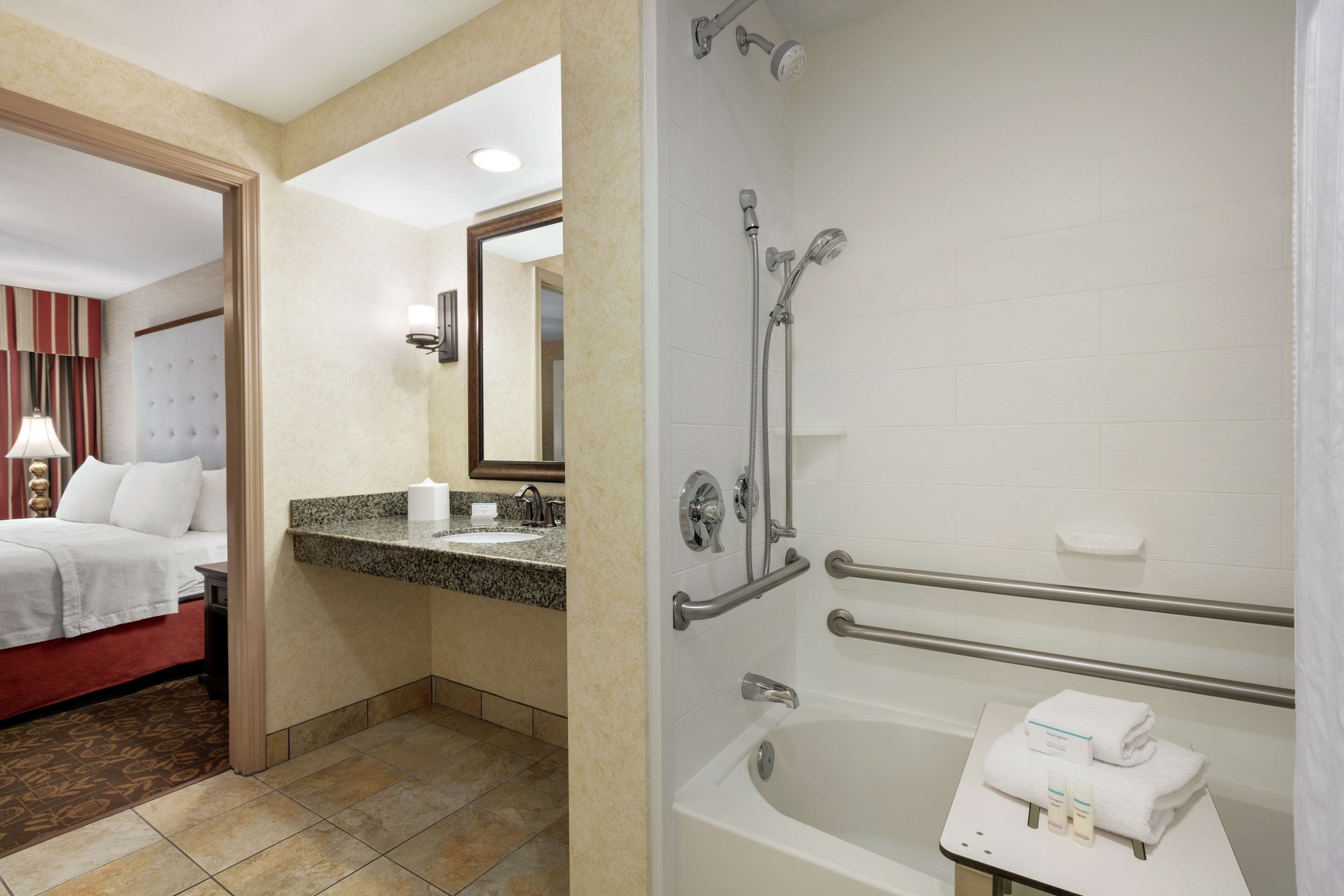 suite, 1 king bed, accessible, bathtub (mobility & hearing) | bathroom | combined shower/bathtub, hydromassage showerhead, free toiletries