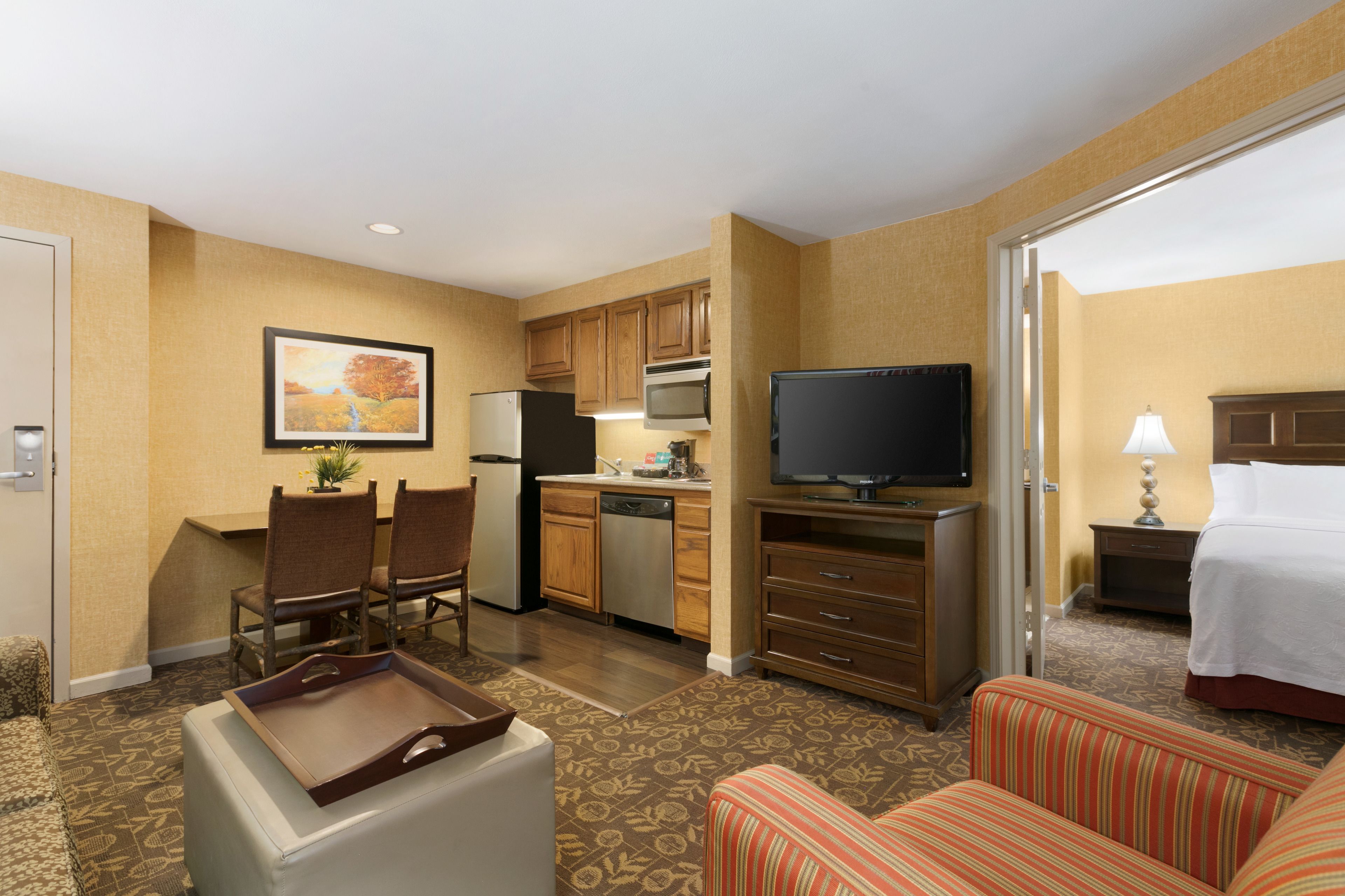 full-sized fridge, microwave, stovetop, dishwasher