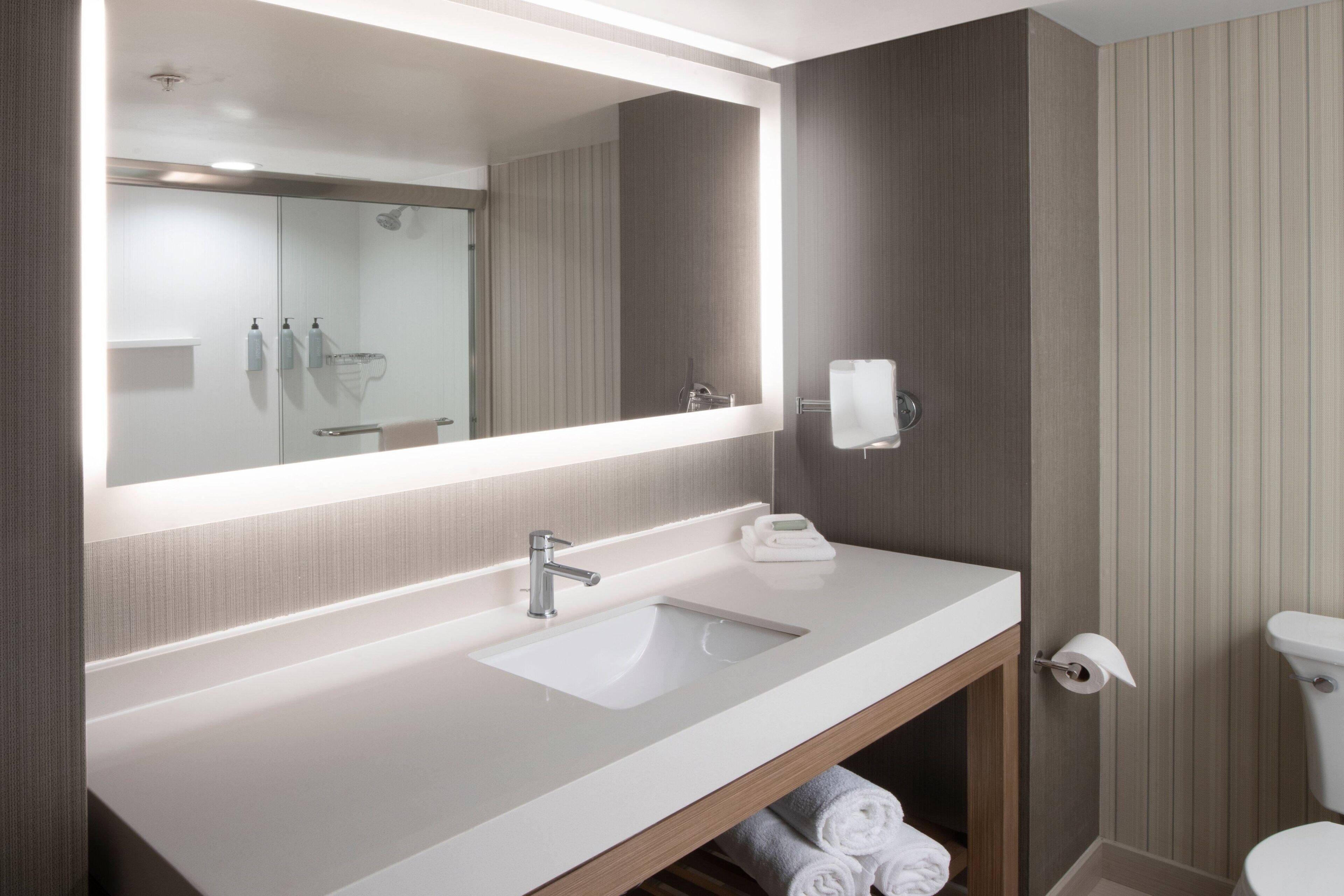 eco-friendly toiletries, hair dryer, towels, soap