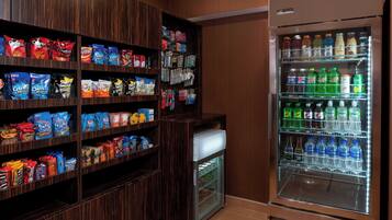 A snack and beverage vending area with various snacks and drinks.