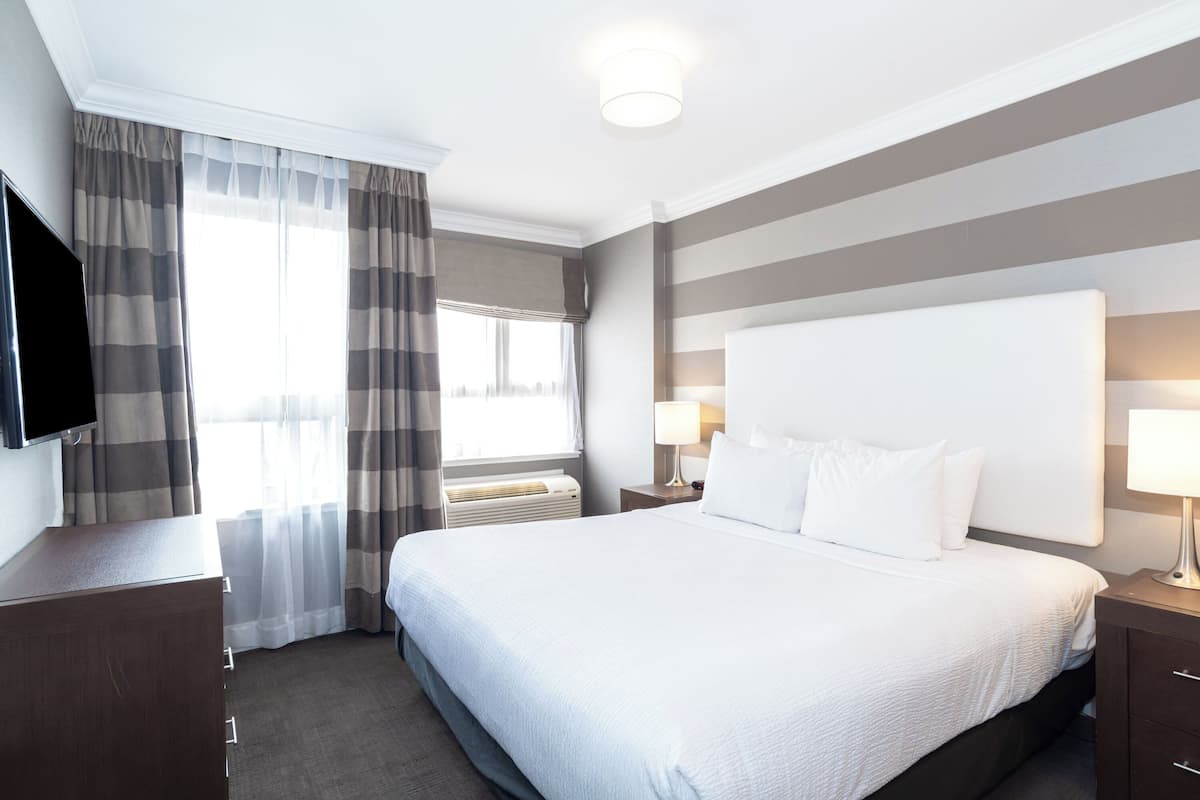 Grand Jacuzzi Suite, 1 King Bed, Sofa Bed, Kitchen, W/D, Balcony, View | Desk, laptop workspace, iron/ironing board, free WiFi