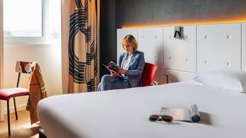 Premium bedding, desk, laptop workspace, blackout curtains