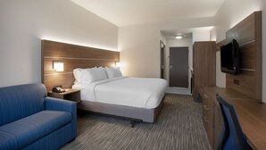 A hotel room with a bed, a desk, a chair, a television, and a nightstand. - Holiday Inn Express - Harrisburg East by IHG (Harrisburg)