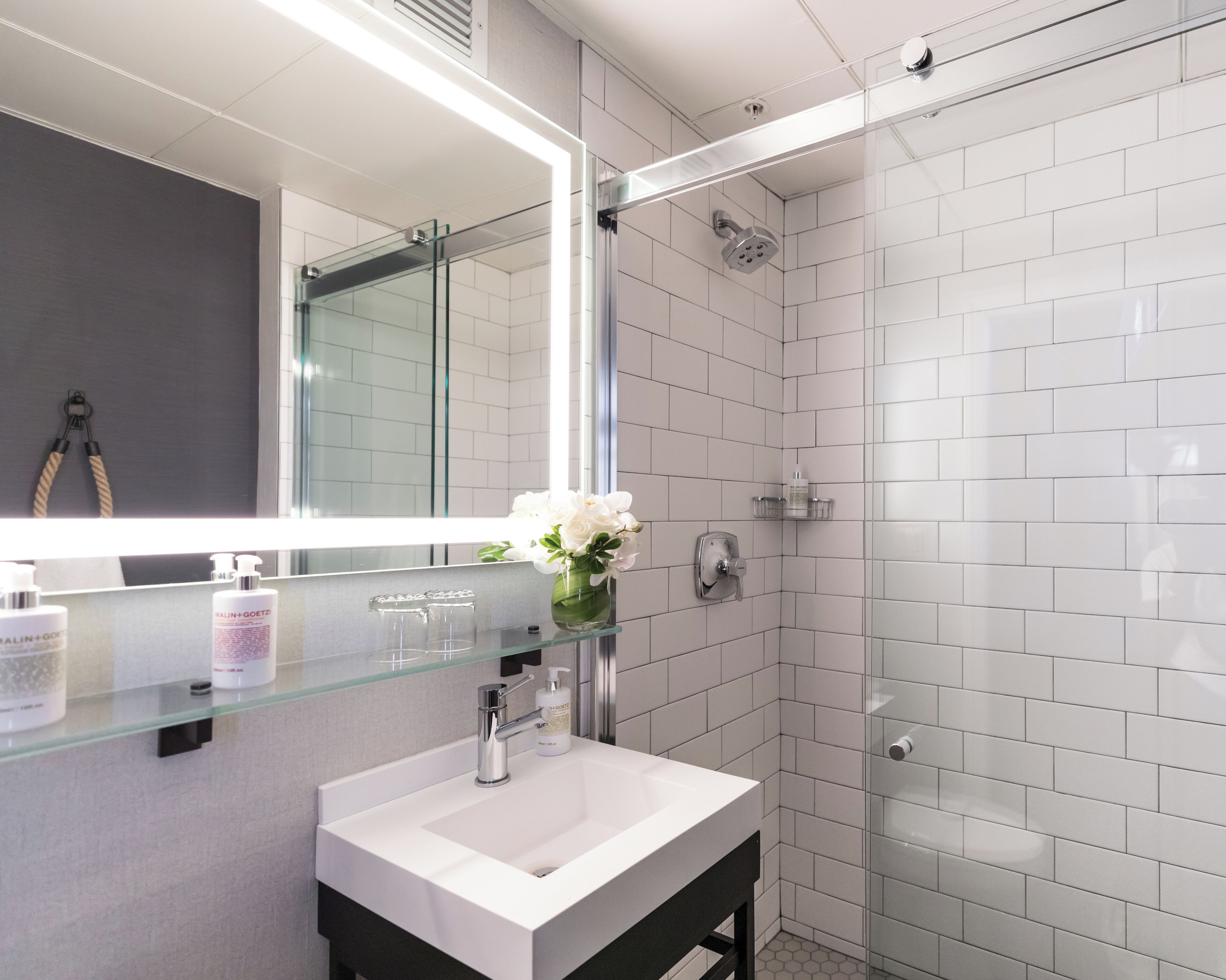 designer toiletries, hair dryer, bathrobes, towels