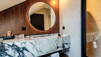 Designer toiletries, hair dryer, bathrobes, slippers