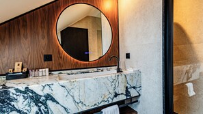 Designer toiletries, hair dryer, bathrobes, slippers