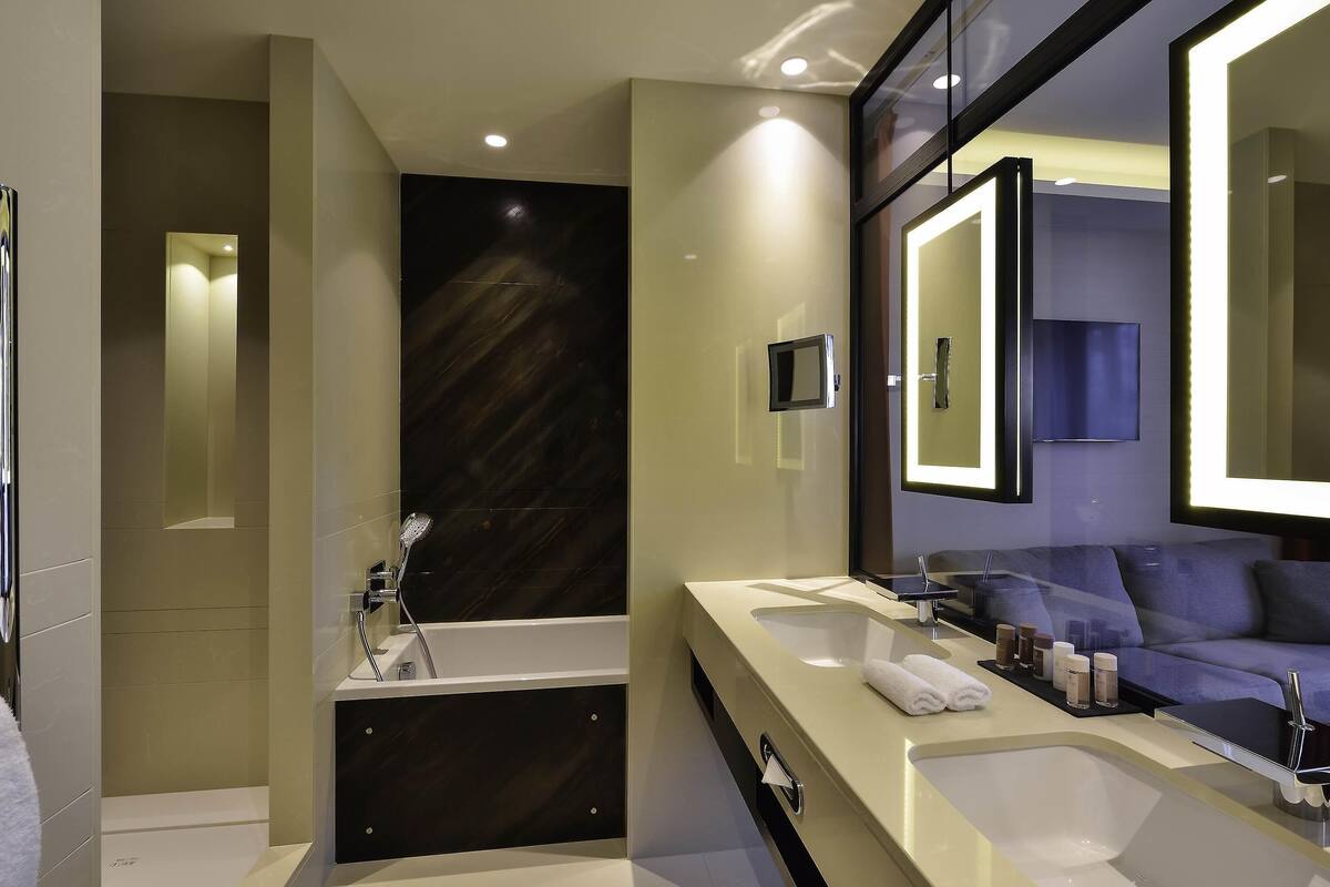 Premium bedding, pillow-top beds, free minibar, in-room safe
