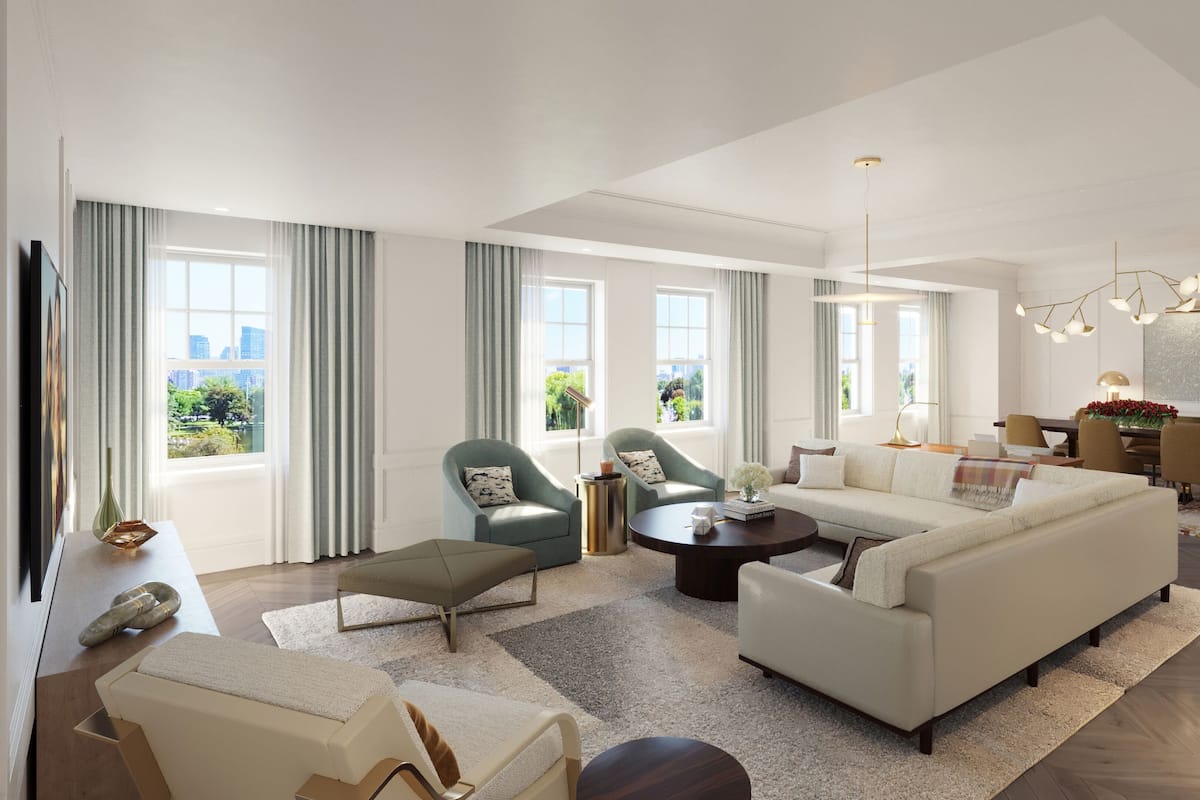 A modern living room with a sofa, armchairs, a coffee table, and a dining area with a table and chairs.