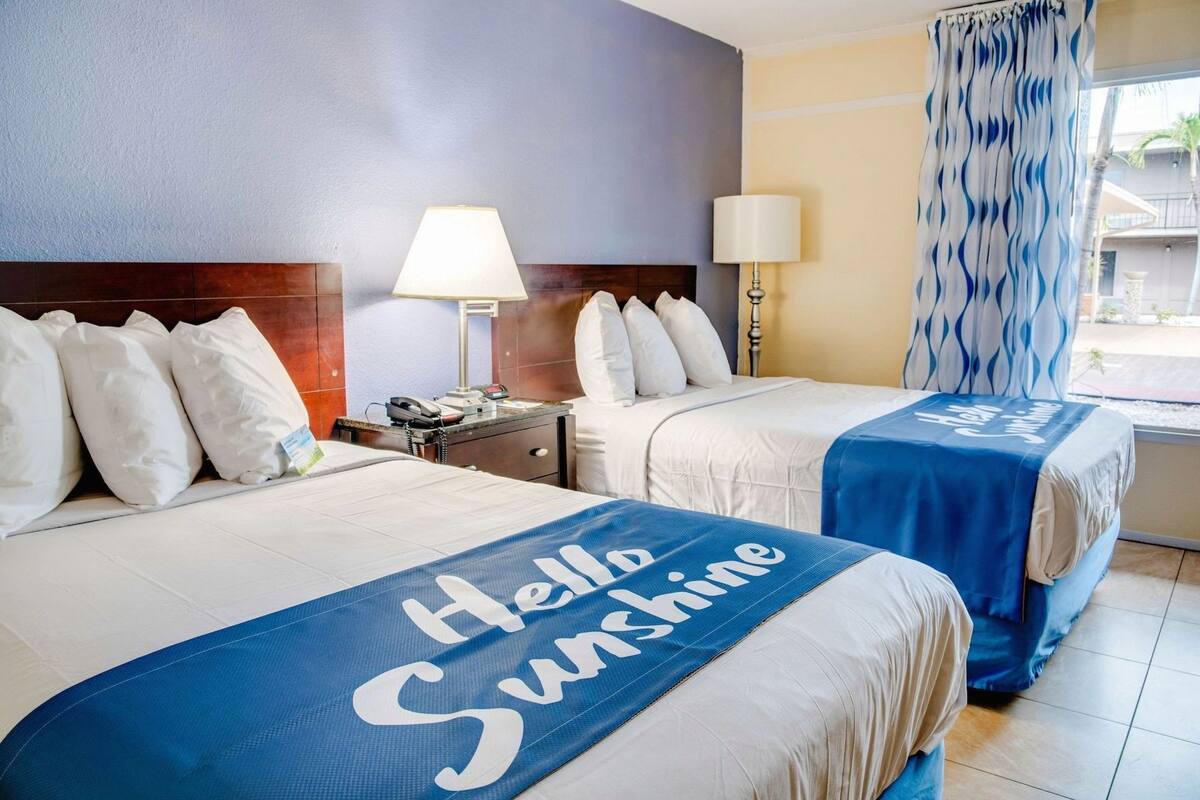 Premium bedding, desk, laptop workspace, blackout curtains