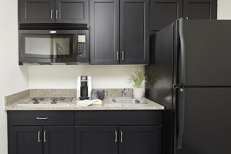 Fridge, microwave, coffee/tea maker, cookware/dishes/utensils